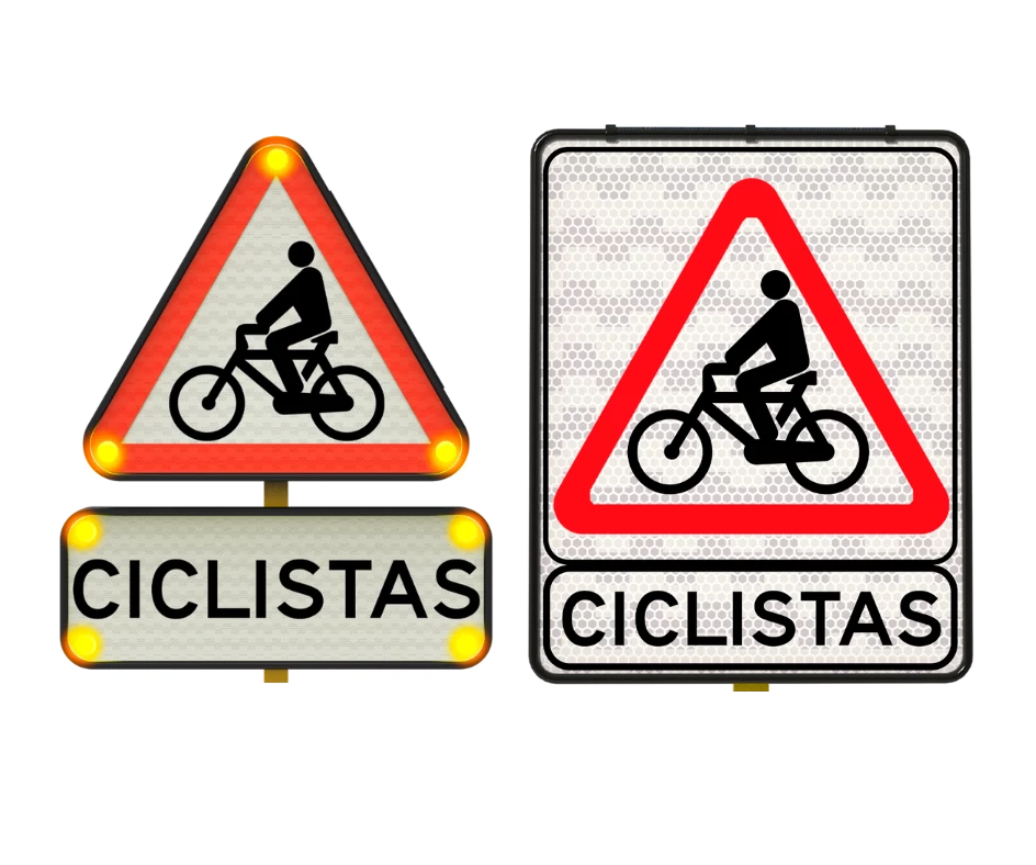 Señales ciclistas triangulares que advierten la presencia de bicicletas en la vía.