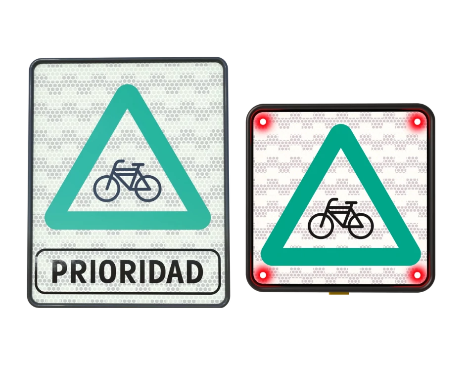 Triángulo verde con bicicleta que indica prioridad de paso a ciclistas en cruces viales.
